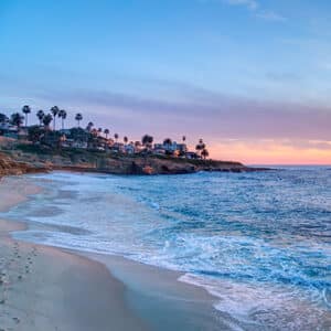 La Jolla coastline as seen by exploring on foot on the sand looking up towards the homes on the cliffs